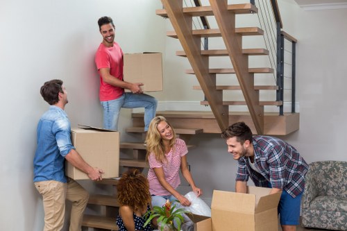 Moving boxes and packing materials prepared for a home move in Twickenham