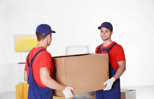 Boxes and furniture representing cubic-yard pricing for a Twickenham move