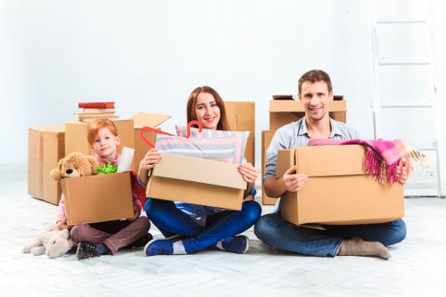 Local movers transporting furniture through a residential street