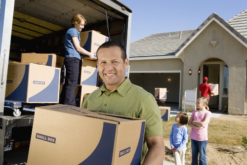 Preparation checklist and packed moving boxes ready for a removal van