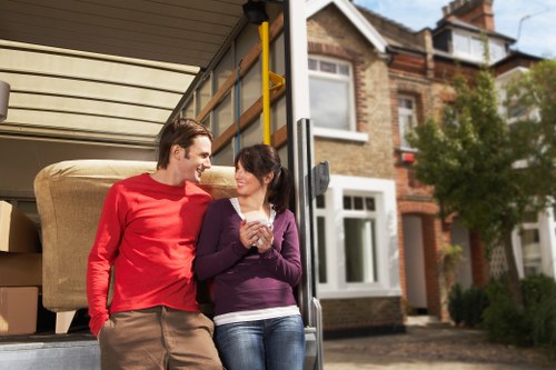 Local movers preparing furniture for safe loading