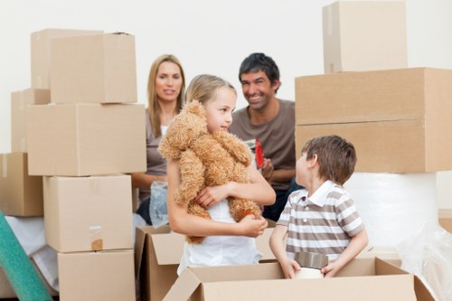 Protected moving team carrying boxes as part of a safe Twickenham removal service